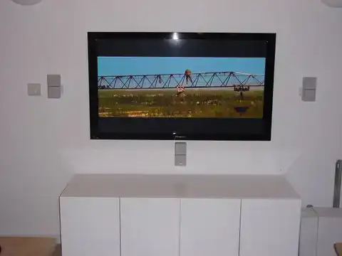 Surround sound speaker installation with wall-mounted TV in Essex